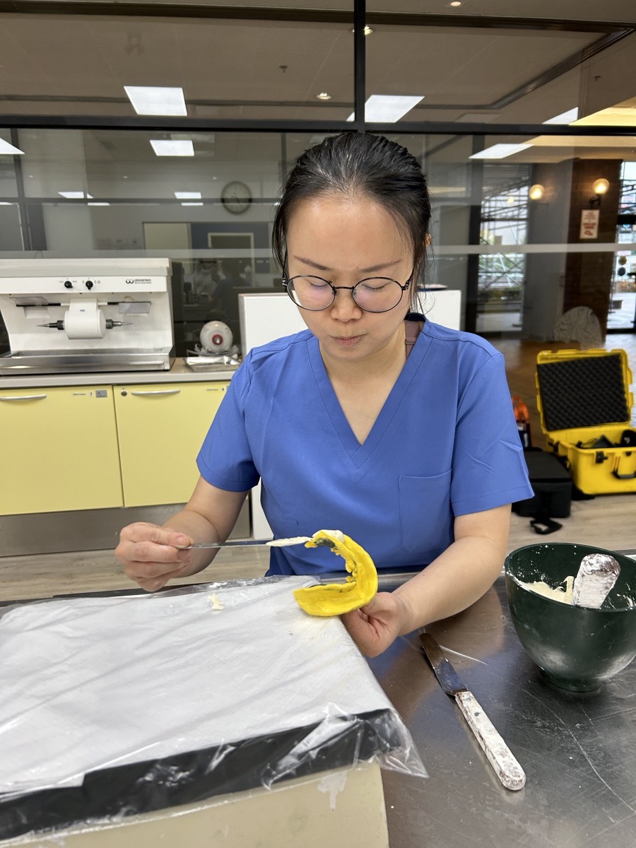 Denturism student taking an impression in the Oxford College dental lab